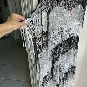 Cover up with open sides and metallic threads and ribbons in silver and black